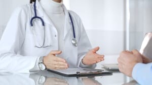A doctor consulting with a patient.