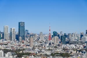 Wide cityscape of Tokyo, Japan, featuring Tokyo Tower.