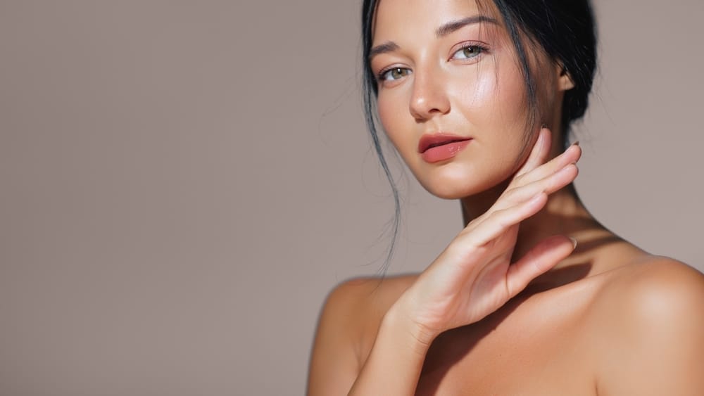 Beauty portrait of a woman showing smooth shoulders and décolletage