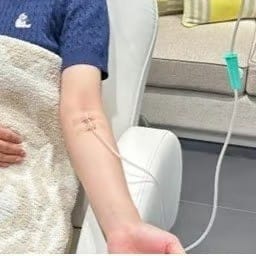 Woman receiving an IV infusion