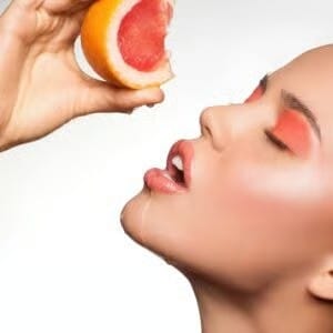 Woman taking vitamin C