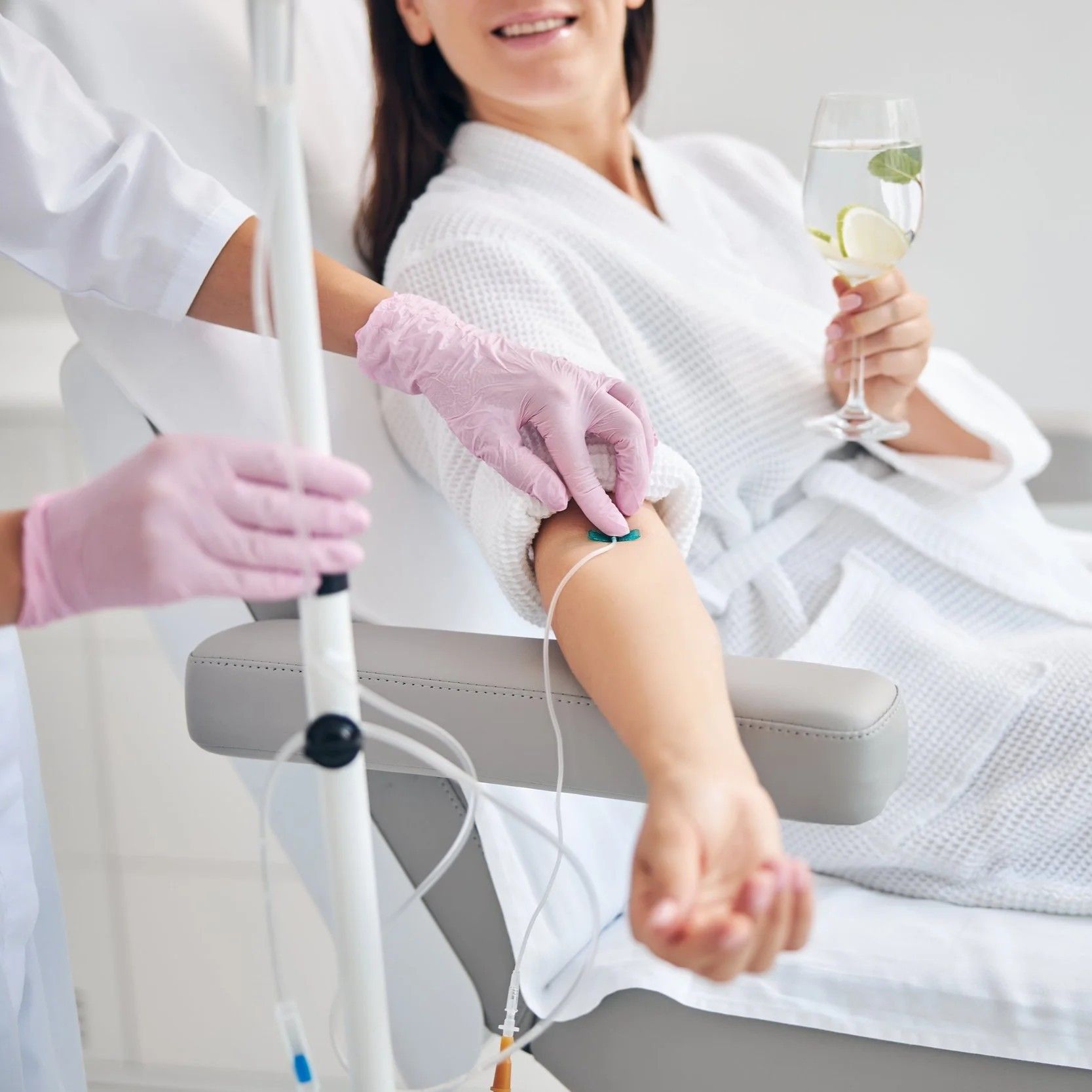 A woman receiving an IV infusion.