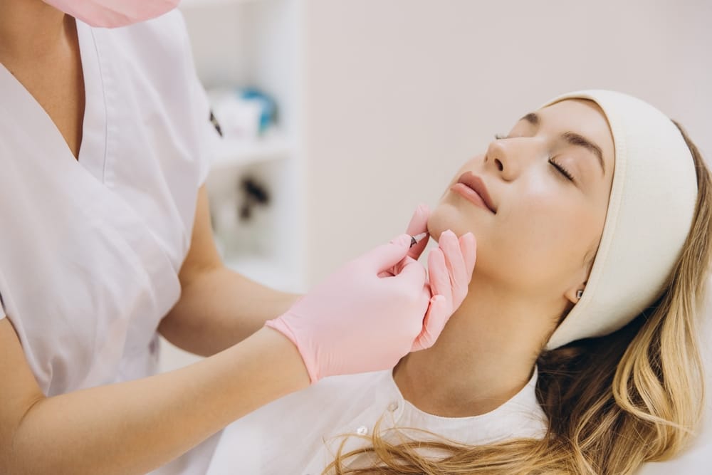 A woman receiving fat-dissolving injections
