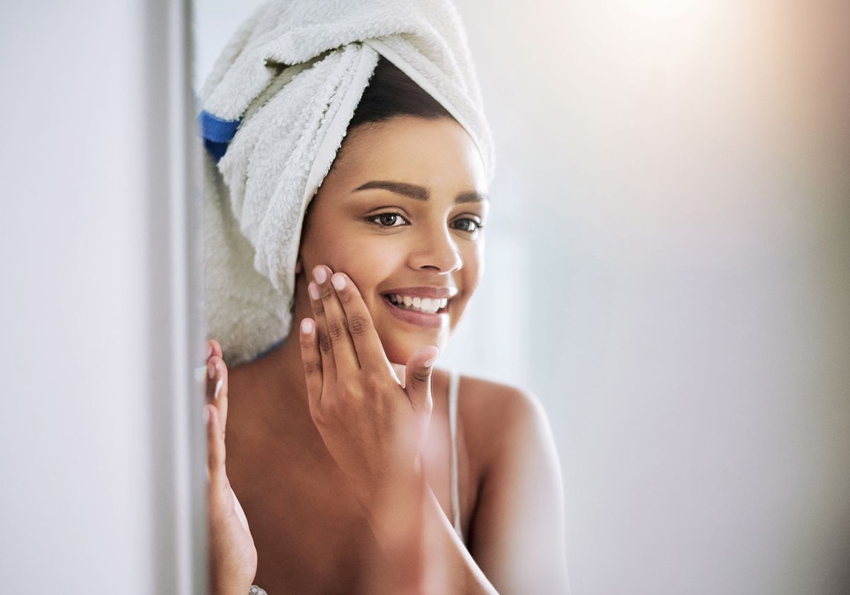A woman with radiant skin achieved through regenerative medicine treatment.