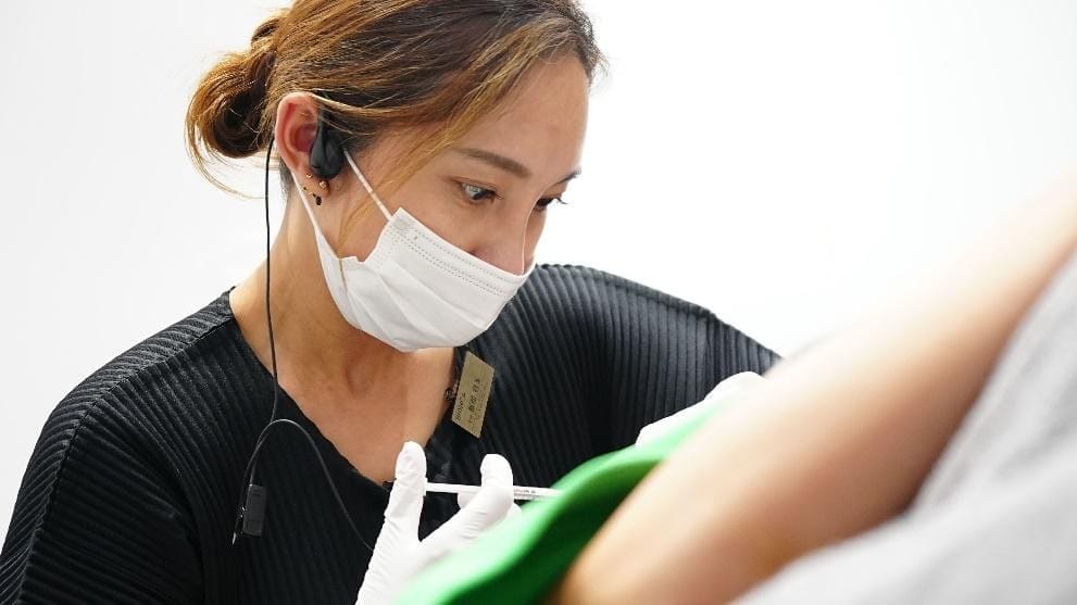 Doctor administering an injection to a patient at BIANCA CLINIC